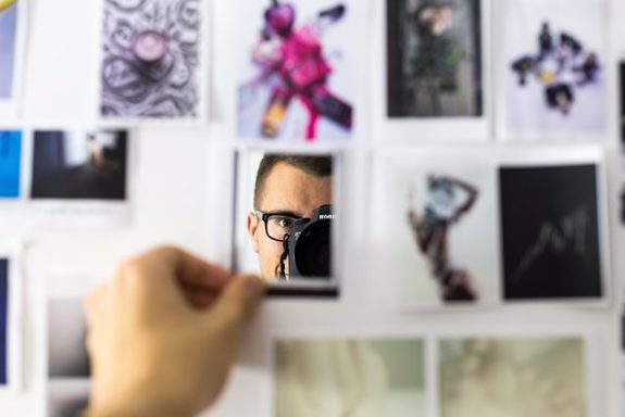 Man taking portrait in mirror. 