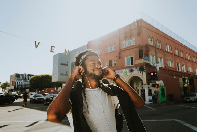 Person smiling listening to music.